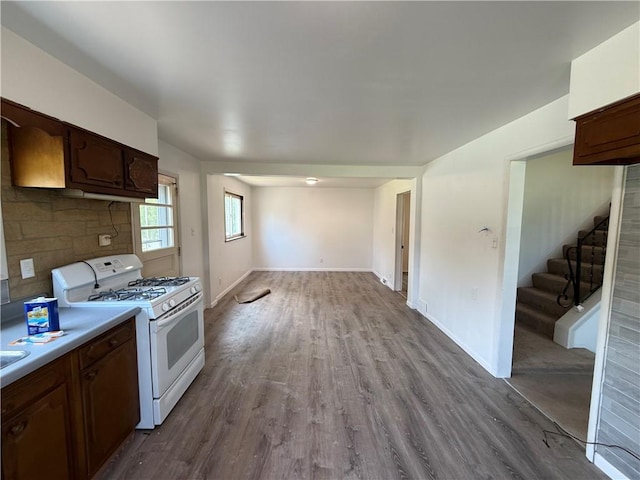 3170 Dutch Ridge Rd, Brighton Twp, PA 15009 - kitchen with white gas range, dark wood-style flooring, light countertops, and dark brown cabinets