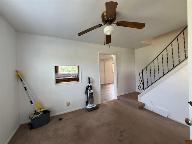 3170 Dutch Ridge Rd, Brighton Twp, PA 15009 - unfurnished living room with carpet flooring, stairs, and a ceiling fan