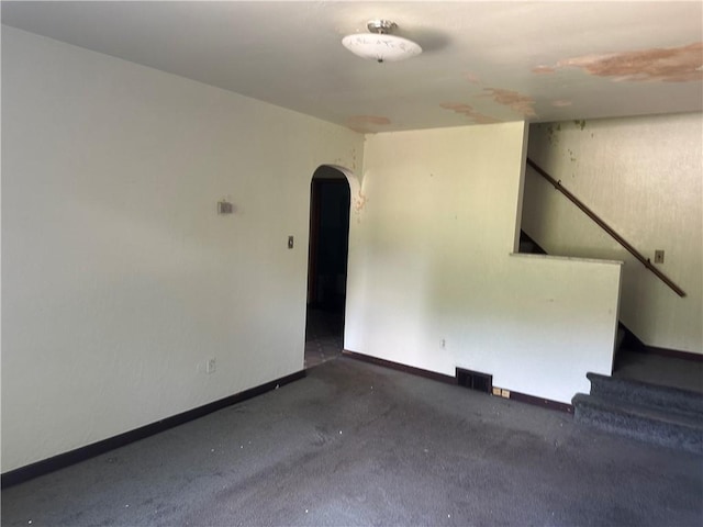 998 Chartiers Ave, Carnegie, PA 15106 - empty room featuring arched walkways, stairway, and carpet floors