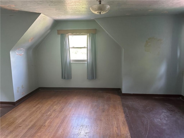 998 Chartiers Ave, Carnegie, PA 15106 - bonus room featuring wood-type flooring, vaulted ceiling, and a textured ceiling