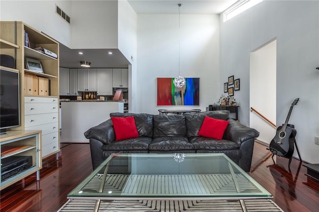 2207 Kenzie Dr, Robinson Twp, PA 15205 - living area featuring a towering ceiling and hardwood / wood-style floors