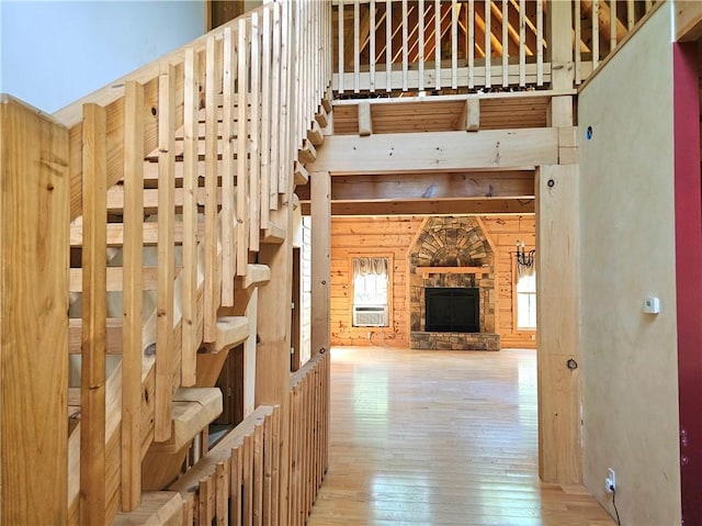 459 Big Knob Rd, New Sewickley Twp, PA 15074 - staircase featuring hardwood / wood-style floors and a stone fireplace