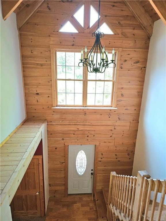 459 Big Knob Rd, New Sewickley Twp, PA 15074 - foyer with wooden walls, a chandelier, beam ceiling, healthy amount of natural light, and high vaulted ceiling