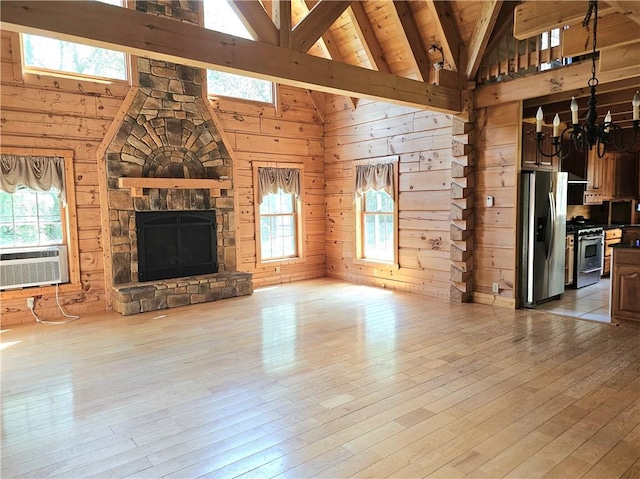 459 Big Knob Rd, New Sewickley Twp, PA 15074 - unfurnished living room featuring a chandelier, wood walls, cooling unit, high vaulted ceiling, and wood-type flooring