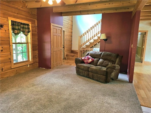 459 Big Knob Rd, New Sewickley Twp, PA 15074 - living room featuring beamed ceiling, wood walls, stairway, and wood-type flooring