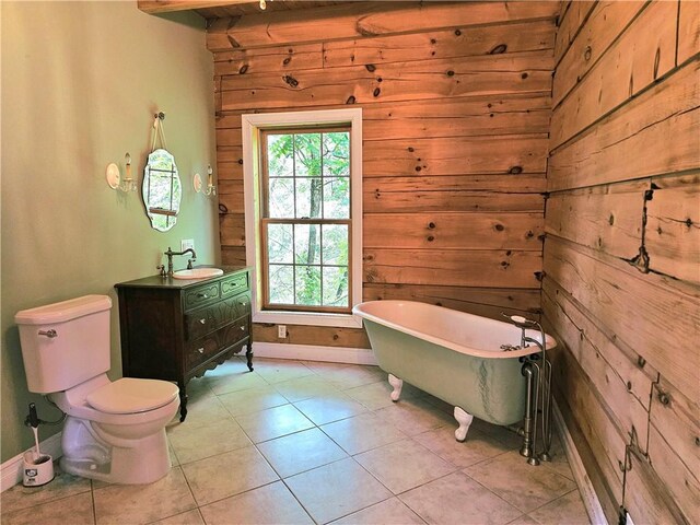 459 Big Knob Rd, New Sewickley Twp, PA 15074 - bathroom with vanity, wooden walls, plenty of natural light, a soaking tub, and tile patterned floors