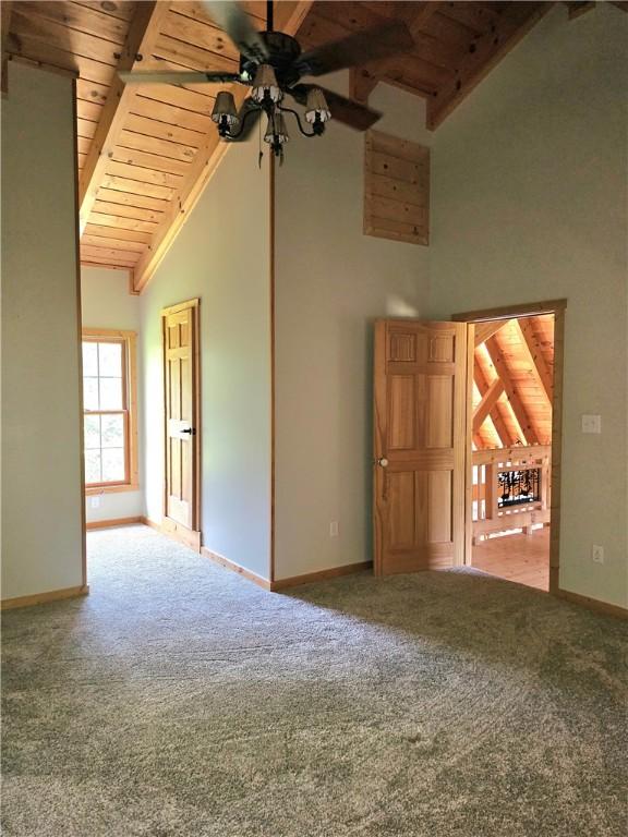 459 Big Knob Rd, New Sewickley Twp, PA 15074 - spare room with a wood ceiling with exposed beams, carpet, ceiling fan, and high vaulted ceiling