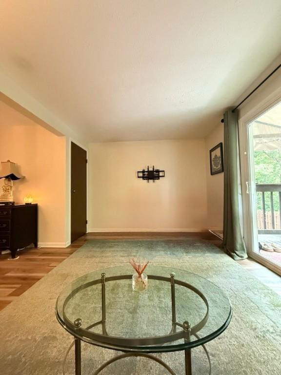 103 Saxonwald Ln, Castle Shannon, PA 15234 - unfurnished living room featuring baseboards and wood finished floors