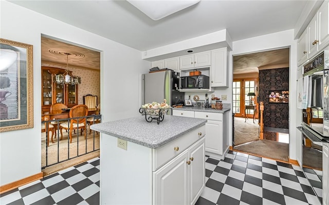 130 Killarney Rd, Pine Twp, PA 15090 - kitchen with dark floors, appliances with stainless steel finishes, a chandelier, and white cabinets