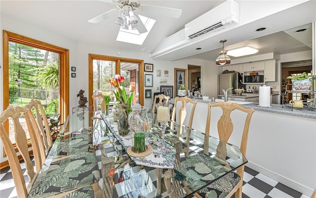 130 Killarney Rd, Pine Twp, PA 15090 - dining room with tile patterned floors, a wall mounted AC, a ceiling fan, and a skylight