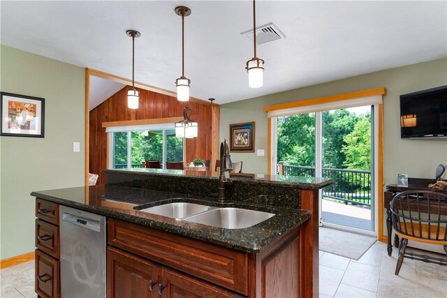 180 Lower Harmony Rd, Connoquenessing Twp, PA 16052 - kitchen featuring dishwasher, an island with sink, dark stone counters, light tile patterned floors, and decorative light fixtures