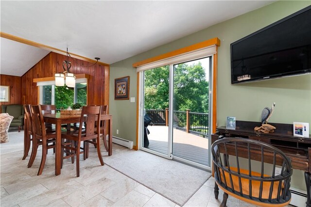 180 Lower Harmony Rd, Connoquenessing Twp, PA 16052 - dining room with plenty of natural light, vaulted ceiling, wood walls, and baseboard heating