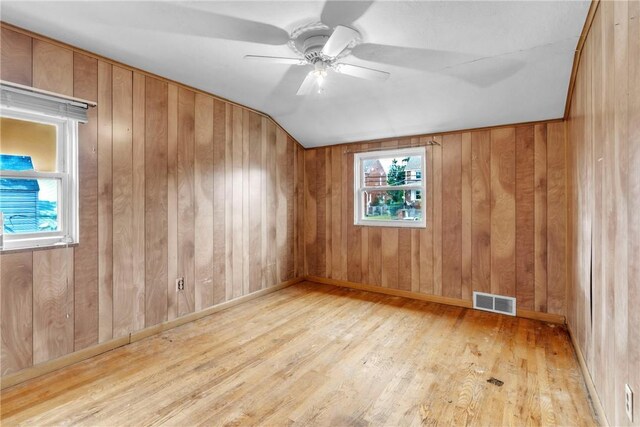 3405 Willett Rd, Baldwin Boro, PA 15227 - empty room featuring ceiling fan, vaulted ceiling, wood finished floors, and wood walls