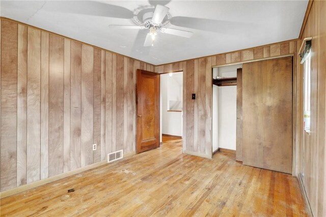 3405 Willett Rd, Baldwin Boro, PA 15227 - unfurnished bedroom featuring light wood-style flooring, wooden walls, a closet, and ceiling fan
