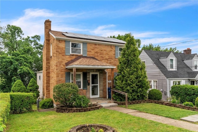 3405 Willett Rd, Baldwin Boro, PA 15227 - traditional-style house with solar panels, a chimney, and a front lawn