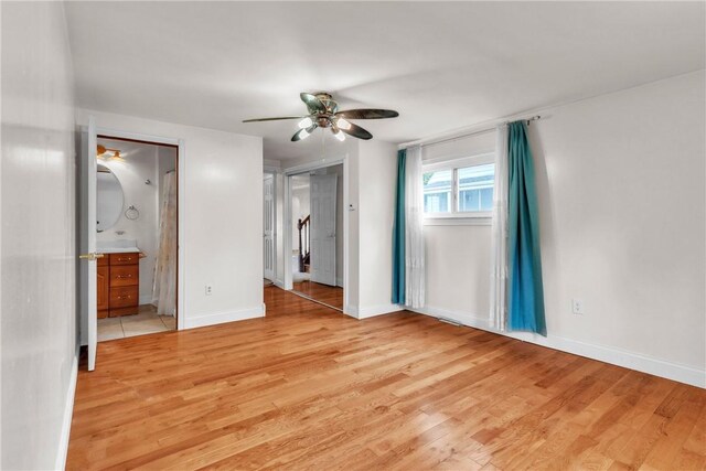 3405 Willett Rd, Baldwin Boro, PA 15227 - unfurnished bedroom with light wood-style floors, a ceiling fan, and ensuite bathroom