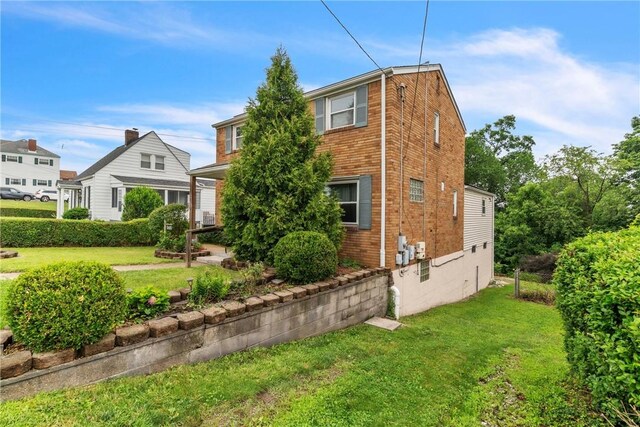3405 Willett Rd, Baldwin Boro, PA 15227 - view of property exterior with a lawn and brick siding