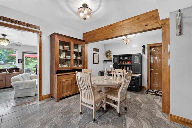 160 Railroad St, Hempfield Twp, PA 15665 - dining space featuring a ceiling fan and wooden walls