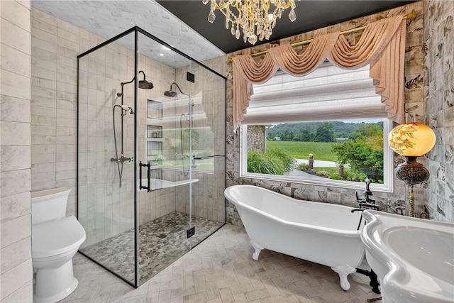 160 Railroad St, Hempfield Twp, PA 15665 - full bath with a freestanding bath, a shower stall, tile walls, and a chandelier