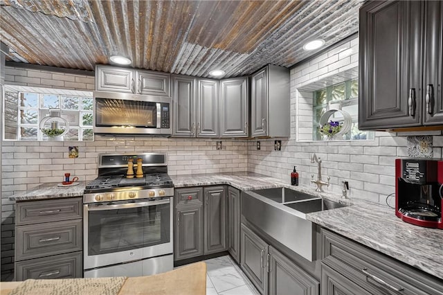 160 Railroad St, Hempfield Twp, PA 15665 - kitchen with stainless steel appliances, gray cabinetry, light marble finish flooring, wooden ceiling, and backsplash
