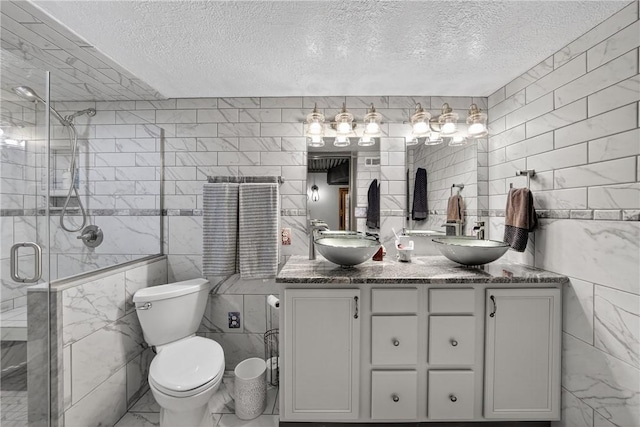 160 Railroad St, Hempfield Twp, PA 15665 - full bath featuring tile walls, a textured ceiling, double vanity, and a stall shower