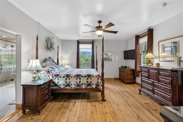 160 Railroad St, Hempfield Twp, PA 15665 - bedroom with light wood-type flooring, ceiling fan, and connected bathroom
