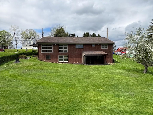 1215 Center Rd, Monaca, PA 15061 - rear view of house with a yard and brick siding