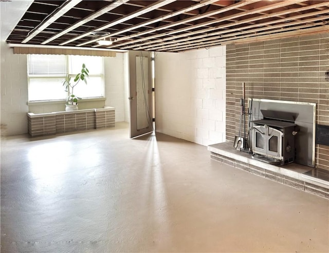 1215 Center Rd, Monaca, PA 15061 - below grade area with a wood stove and concrete block wall