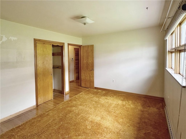 1215 Center Rd, Monaca, PA 15061 - unfurnished bedroom with a baseboard radiator and light wood finished floors