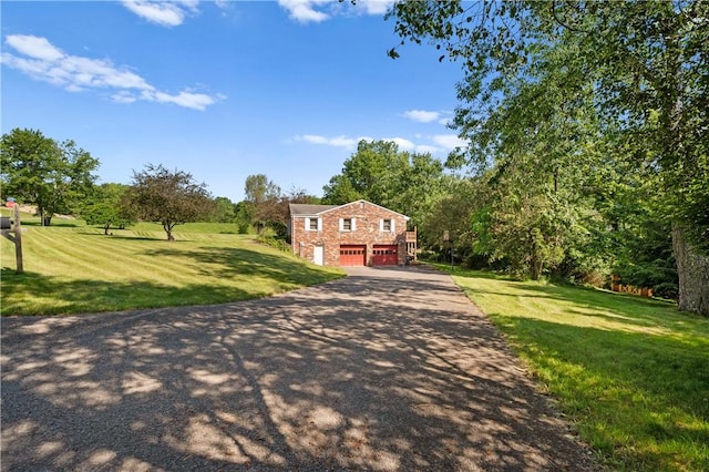 1222 Lakevue Dr, Penn Twp, PA 16002 - view of front of house featuring a garage, driveway, and a front lawn
