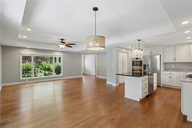 200 Neville, Edgeworth, PA 15143 - kitchen featuring a tray ceiling, recessed lighting, white cabinets, a kitchen island, and open floor plan
