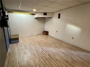 3329 Recker Dr, Baldwin Boro, PA 15227 - finished basement featuring a paneled ceiling and wood finished floors