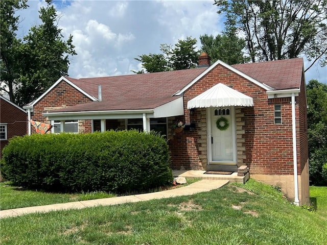 3329 Recker Dr, Baldwin Boro, PA 15227 - view of front of property with brick siding, a chimney, a shingled roof, and a front yard