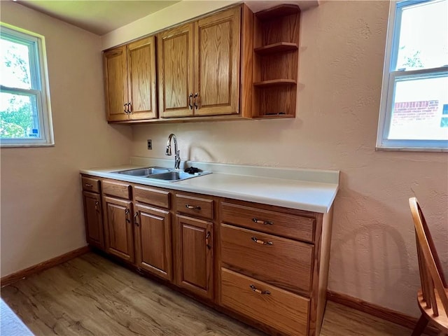 3329 Recker Dr, Baldwin Boro, PA 15227 - kitchen with brown cabinets, light wood-style floors, light countertops, and open shelves