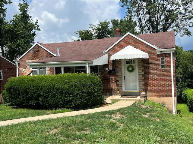 3329 Recker Dr, Baldwin Boro, PA 15227 - ranch-style house with a chimney, brick siding, a front lawn, and a shingled roof