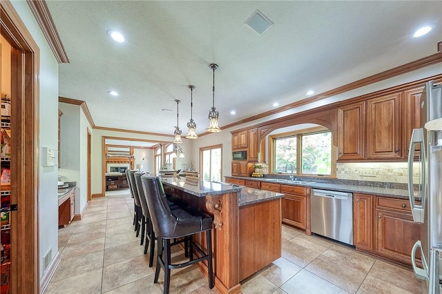 522 Salem Hts, Pine Twp, PA 15044 - kitchen with stainless steel appliances, brown cabinets, ornamental molding, tasteful backsplash, and recessed lighting