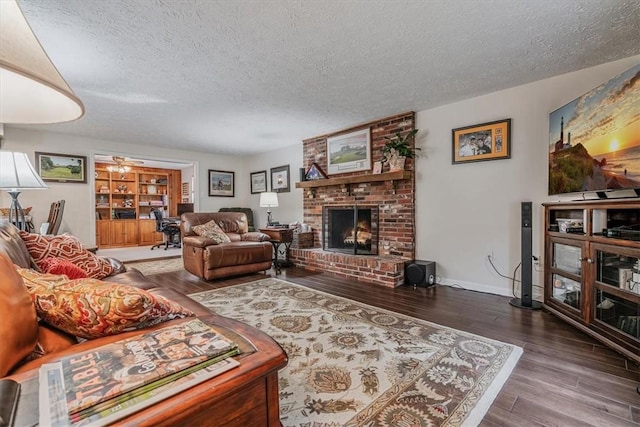 27 Watson St, Leet Twp, PA 15143 - living room featuring a textured ceiling, a fireplace, and wood finished floors