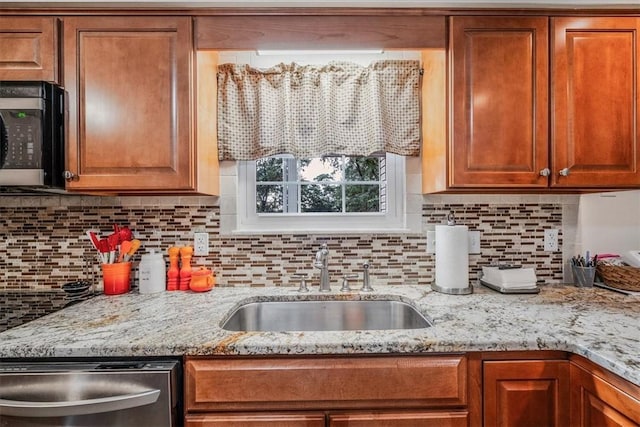 27 Watson St, Leet Twp, PA 15143 - kitchen with stainless steel appliances, decorative backsplash, brown cabinets, and light stone counters