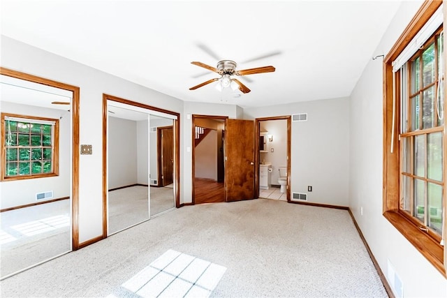 479 Bell Run Rd, Waynsbrg/Frankln Twp, PA 15362 - unfurnished bedroom with multiple windows, carpet floors, ensuite bathroom, and ceiling fan