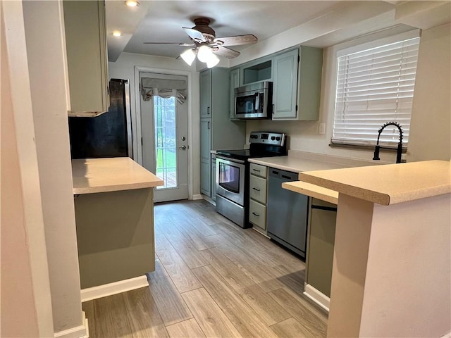 716 Vallevista Ave, Mt Lebanon, PA 15234 - kitchen with stainless steel appliances, light wood-type flooring, light countertops, ceiling fan, and recessed lighting