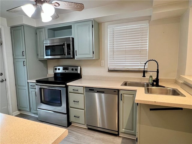 716 Vallevista Ave, Mt Lebanon, PA 15234 - kitchen with stainless steel appliances, light countertops, light wood-style flooring, and ceiling fan