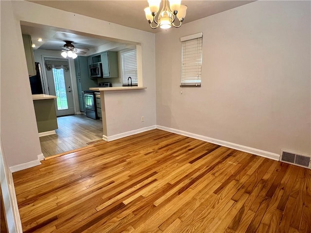 716 Vallevista Ave, Mt Lebanon, PA 15234 - empty room featuring light wood finished floors, a chandelier, and ceiling fan