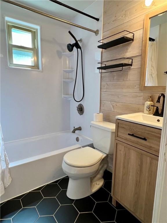 716 Vallevista Ave, Mt Lebanon, PA 15234 - full bathroom featuring vanity, wooden walls, and shower / bath combo with shower curtain