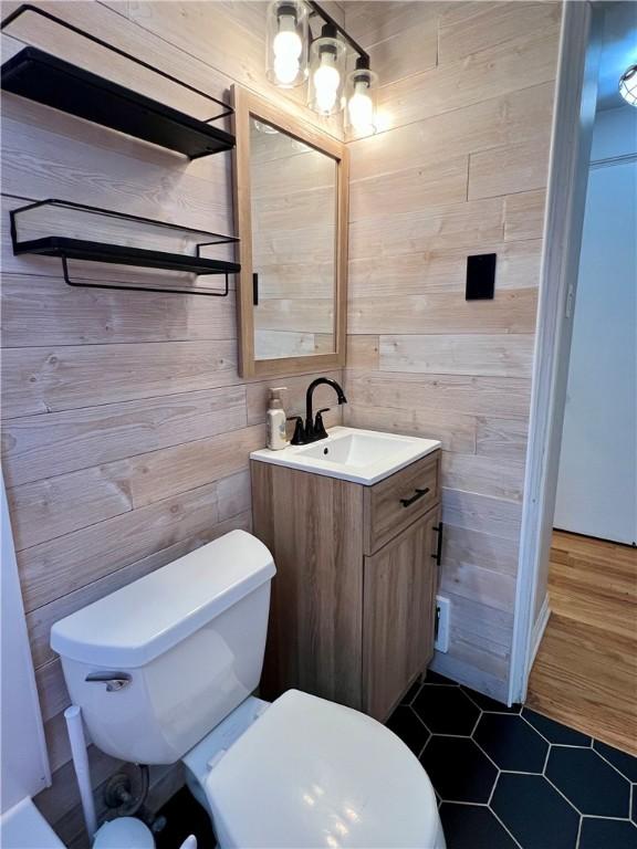 716 Vallevista Ave, Mt Lebanon, PA 15234 - bathroom featuring vanity, wood walls, and tile patterned floors