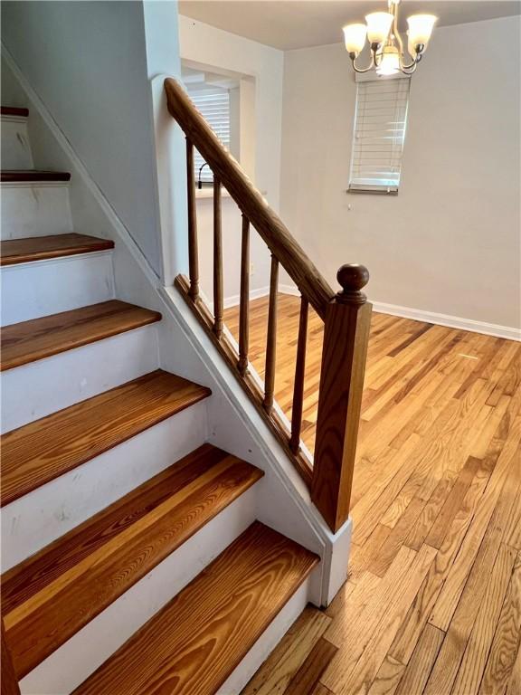 716 Vallevista Ave, Mt Lebanon, PA 15234 - stairs featuring wood finished floors and a chandelier