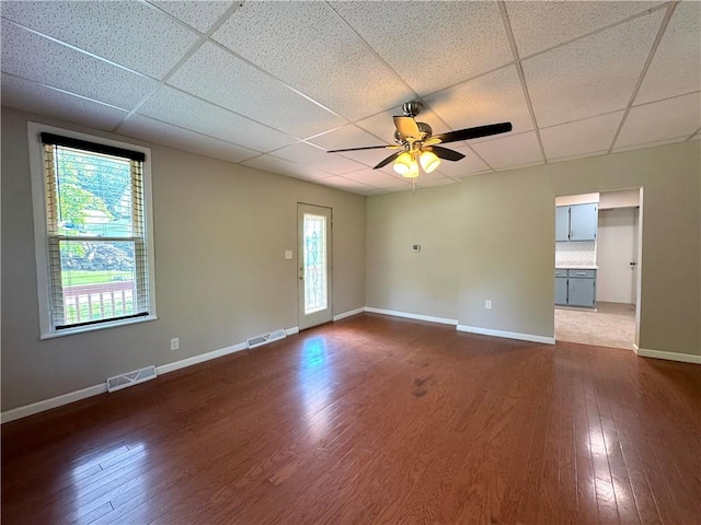 81 Baltimore St, Irwin, PA 15642 - unfurnished room featuring a drop ceiling, dark wood finished floors, and ceiling fan