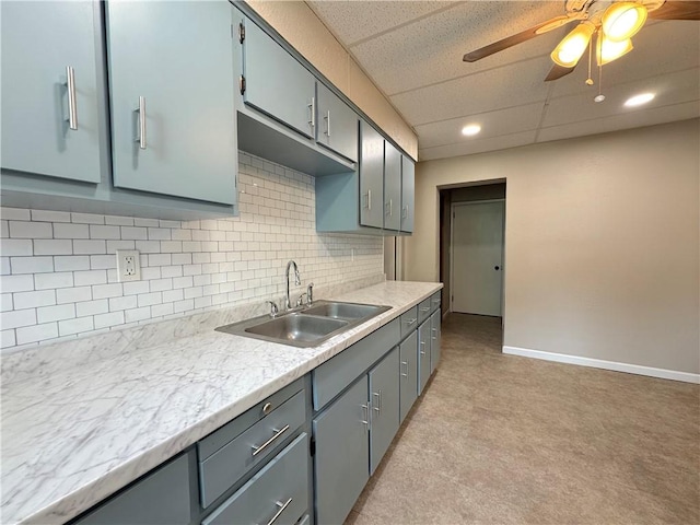 81 Baltimore St, Irwin, PA 15642 - kitchen featuring gray cabinets, light countertops, ceiling fan, decorative backsplash, and recessed lighting