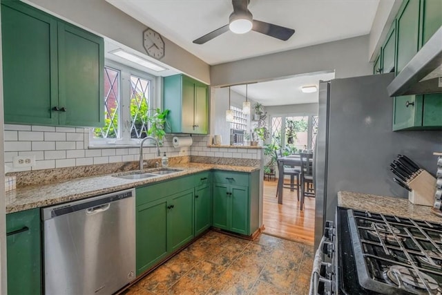 310 Glaser Ave, Bellevue, PA 15202 - kitchen with dishwasher, green cabinetry, exhaust hood, and plenty of natural light