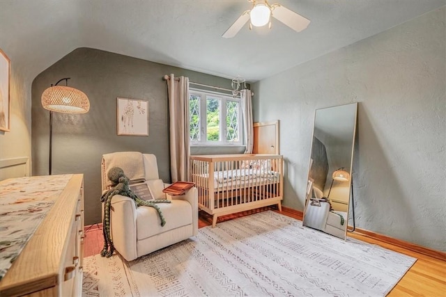 310 Glaser Ave, Bellevue, PA 15202 - living area with wood finished floors, ceiling fan, vaulted ceiling, and a textured wall