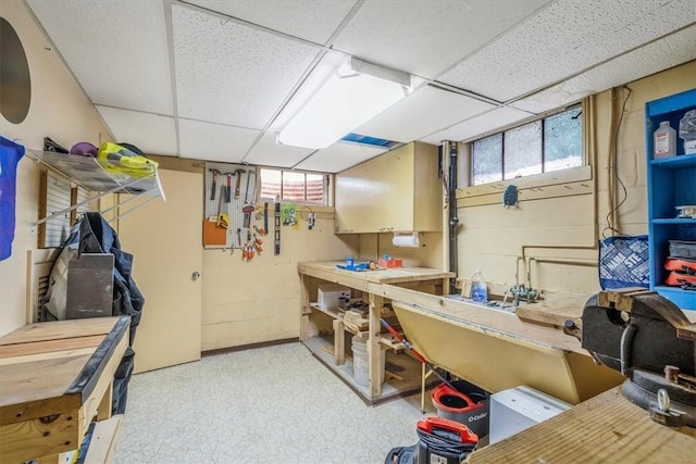 310 Glaser Ave, Bellevue, PA 15202 - basement with a workshop area, a drop ceiling, and light floors